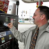 Customer users credit card to pay for gas. 