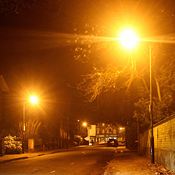 Street lamps light a deserted street 