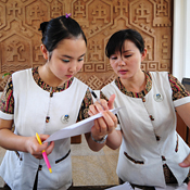 Hotel staff check a customer's billing in China 