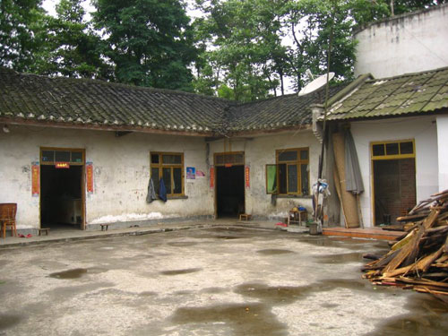 
                The home of farmer Xiong Guo Xiu in Tan Mu village, 40 km from the earthquake's epicenter. She accuses local officials of using the earthquake as an excuse to raze her home and redevelop the land.
                                    (Lisa Chow)
                                