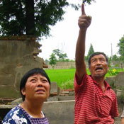 villagers point to damage 