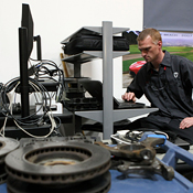 Tesla Motors technician at work station 