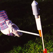 Lighting the fuse of a firework 