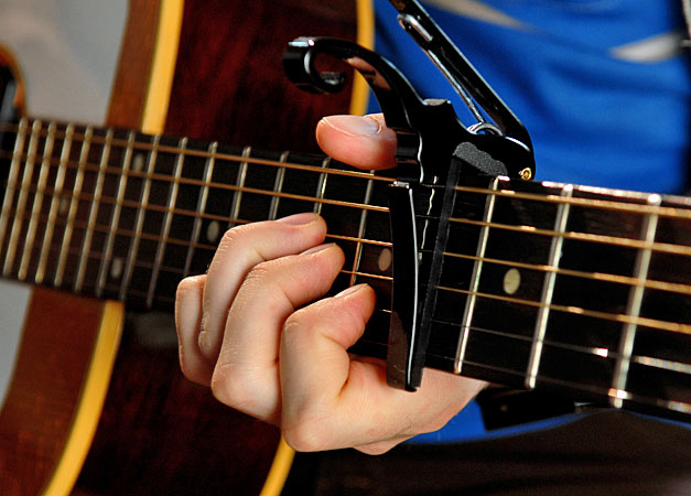 Singer/songwriter Jeremy Messersmith plays his guitar while composing a song. Singer/songwriter Jeremy Messersmith plays his guitar while composing a song.
