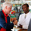 Clinton with pharmacist in Tanzania