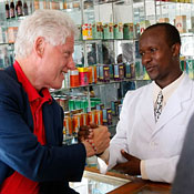 Clinton with pharmacist in Tanzania 