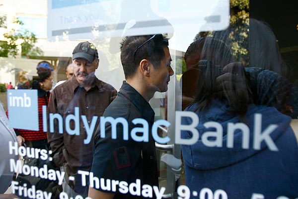 
                IndyMac customers are allowed through the doors of its office in Pasadena, Calif., after waiting in line with hundreds of others. The bank was opening for the first time, three days after the federal government takeover of the thrift on July 11, 2008.
                                    (David McNew/Getty Images)
                                