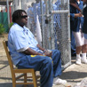 Inmate Bernard Moss holds the line at the gate.