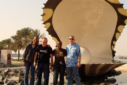 
                    U.S. soldiers get to be tourists on their four-day R&R pass in Qatar. Four soldiers serving in Iraq pose in front a 'pearl' on the seaside of Qatar's capital, Doha. Qatar is famous for its pearls.
                                            (Orly Halpern)
                                        