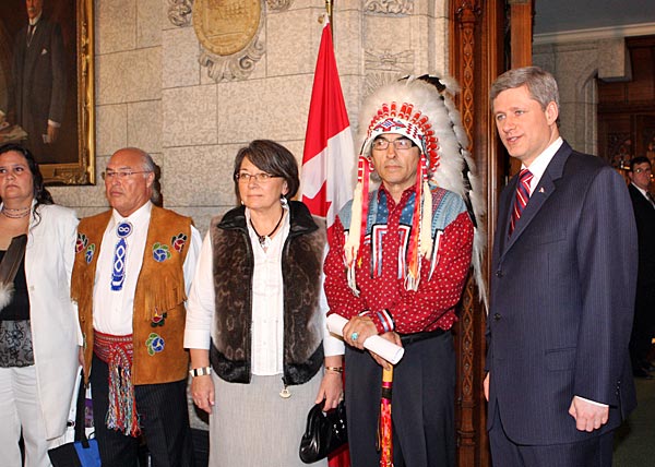 
                Canadian Prime Minister Stephen Harper, far right, and National Chief of the Assembly of First Nations Phil Fontaine pause before walking into the House of Commons on Parliament Hill on June 11, 2008, in Ottawa, Canada. Harper delivered a formal statement of apology on behalf of the federal government and all Canadians to former students of Indian Residential Schools, who for decades were forcibly removed from their communities and sent to state-funded schools to be assimilated.
                                    (Mike Carroccetto/Getty Images)
                                