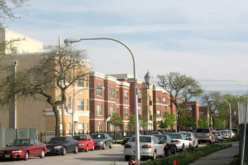 
                    The newly gentrified neighborhood around the boarded building that might be the future home of the Public Housing Museum.
                                            (Laurie Stern)
                                        