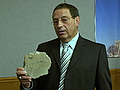 Sen. Jim Carlson with a chunk of a bridge