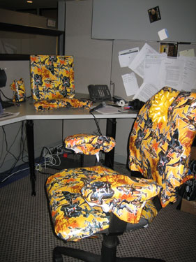 
                The desk and chair of Marketplace Commentary Editor Kevin Arnovitz is gift-wrapped for his arrival. The prank is one of many mentioned in John Austin's book, "Cubicle Warfare."
                                    (Caitlan Carroll / Marketplace)
                                
