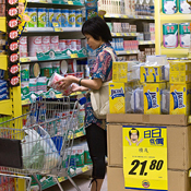Woman considers product in a Hong Kong store 