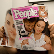 A woman reads People magazine 