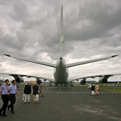 People walking past an Airbus A380 plane. 