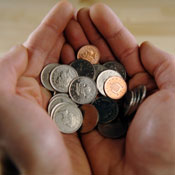 Hand holding coins 