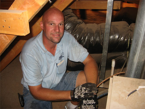 
                Air conditioner repairman Russ Wichterman
                                    (Rene Gutel)
                                
