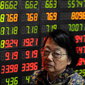 An investor at the stock board in Shanghai 