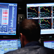 A trader at his computer at the NYSE 
