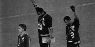 Tommie Smith (center) and John Carlos (right)
