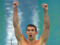 Michael Phelps reacts after 8th gold medal