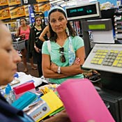 Wal-Mart customer waits to pay for purchases. 