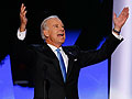 Joe Biden raises his arms at delegates at the DNC