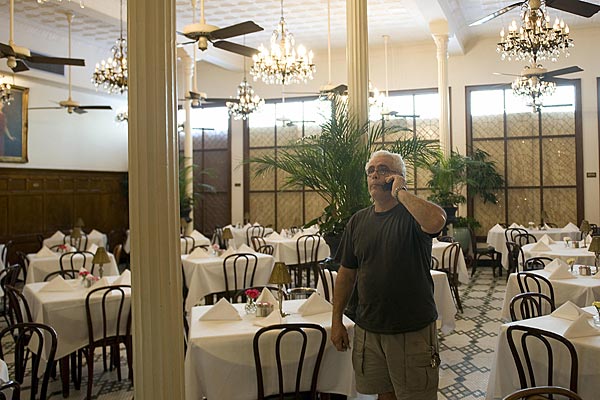 
                Charles Abbyad, head matre d' of the French Creole restaurant Arnauds in the French Quarter of New Orleans, speaks with the restaurant owner after checking for damages Tuesday.
                                    (Jim Watson/AFP/Getty Images)
                                