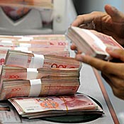 Chinese 100 yuan notes counted at Shanghai bank 