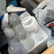 Box of recyclables, including CFLs 