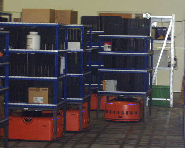 
                Robots hauling packages for shipping.
                                    (Sally Herships)
                                