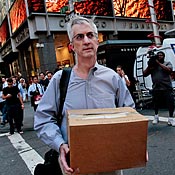 An employee of Lehman Brothers Holdings Inc. carries a box out of the company's headquarters on Monday.