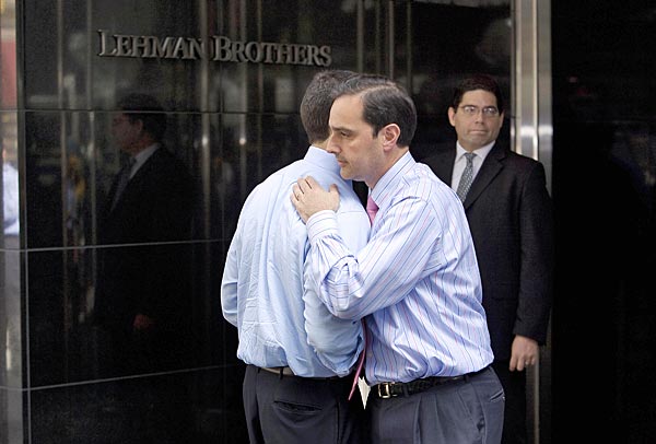 
                Two men hug outside the Lehman Brothers headquarters building in New York City on Monday.
                                    (Nicholas Roberts/AFP/Getty Images)
                                
