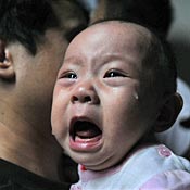 Baby who drank tainted milk powder gets exam 