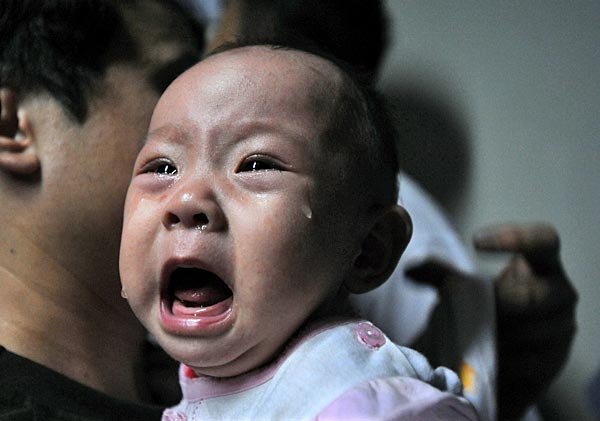 
                A baby who drank tainted milk powders receives a type-B ultrasonic examination in a hospital in Wuhan, Hubei Province, China.
                                    (China Photos/Getty Images)
                                