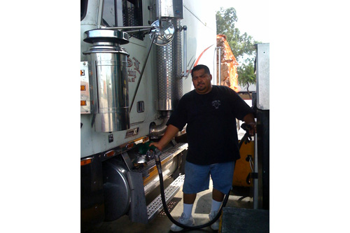 
                    Trucker Jesse Cerna of Glendale, Ariz., pauses at the Liberty Fuel Travel Center to fill his tank.
                                            (Rene Gutel)
                                        