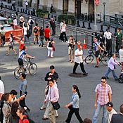 Pedestrians walk by the New York Stock Exchange 