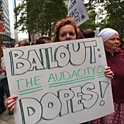 People rally in the financial district against the proposed government bailout of financial firms on Sept. 25, 2008 in New York City. In response to the global financial crisis, dozens of protesters, from a variety of activist groups, denounced the capitalist system, Wall Street and the Bush administration.