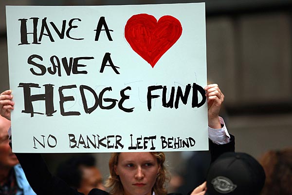 
                People rally in the financial district against the proposed government buyout of financial firms on Sept. 25, 2008, in New York City. In response to the global financial crisis, dozens of protesters, from a variety of activist groups, denounced the capitalist system, Wall Street and the Bush administration.
                                    (Spencer Platt/Getty Images)
                                