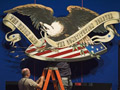 Stage crew members prepare for debate
