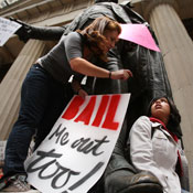 People rally in front of the NY Stock Exchange 