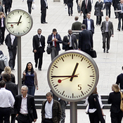 City workers walk through London's Canary Wharf 