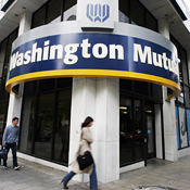 People walk past a Washington Mutual bank 