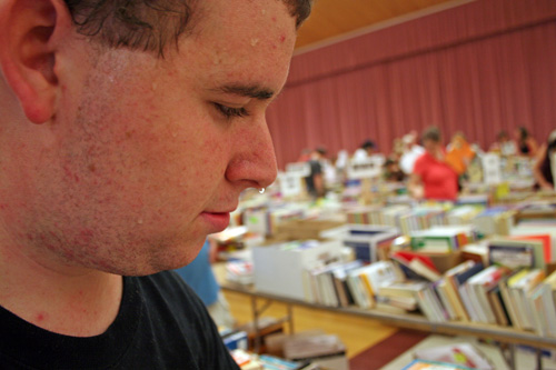 
                    Some book sellers drip with sweat at the C.H. Booth Library book sale in New Town, Connecticut.  New scanning technology is making book sales more competitive and stressful.
                                            (Khanh Tran)
                                        