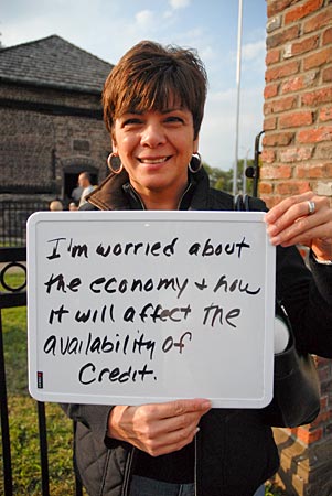 
                Pittsburgh celebrated its 250th birthday Saturday in Point State Park, at the confluence of the city's three rivers. The festivities included live performances, historical reenactments, and an extravagant fireworks display after dark.  We asked some folks to show us what's been on their minds lately, as they've been considering the current economy. Above, Lynn Kaye displays her concern.
                                    (Alexander Heilner)
                                