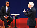 Sen. Barack Obama (L) listens to Sen. John McCain