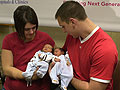 Jeane and Jeff Cassellius  hold their new twins
