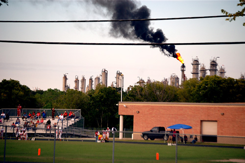 The Texas Petrochemicals flare above Cesar Chavez High School in Houston. The Texas Petrochemicals flare above Cesar Chavez High School in Houston.