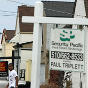 For sale signs are posted in front of homes in CA 